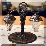 K19. Silverplate and glass grape-shaped salt and pepper set.